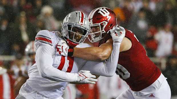 Ohio State Buckeyes defensive end Tyreke Smith (11) moves past Indiana Hoosiers offensive lineman Luke Haggard (70) during the second quarter of a NCAA Division I football game between the Indiana Hoosiers and the Ohio State Buckeyes on Saturday, Oct. 23, 2021 at Memorial Stadium in Bloomington, Ind. Cfb Ohio State Buckeyes At Indiana Hoosiers
